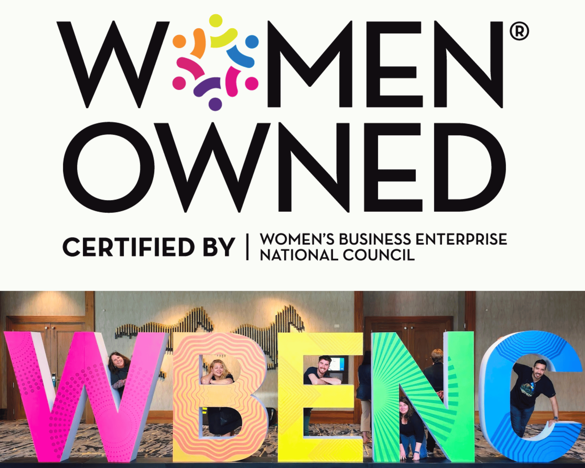 Women Owned Business Certification Logo, picture of our team members posing behind each letter in WBENC - a life-sized conference lobby decoration.